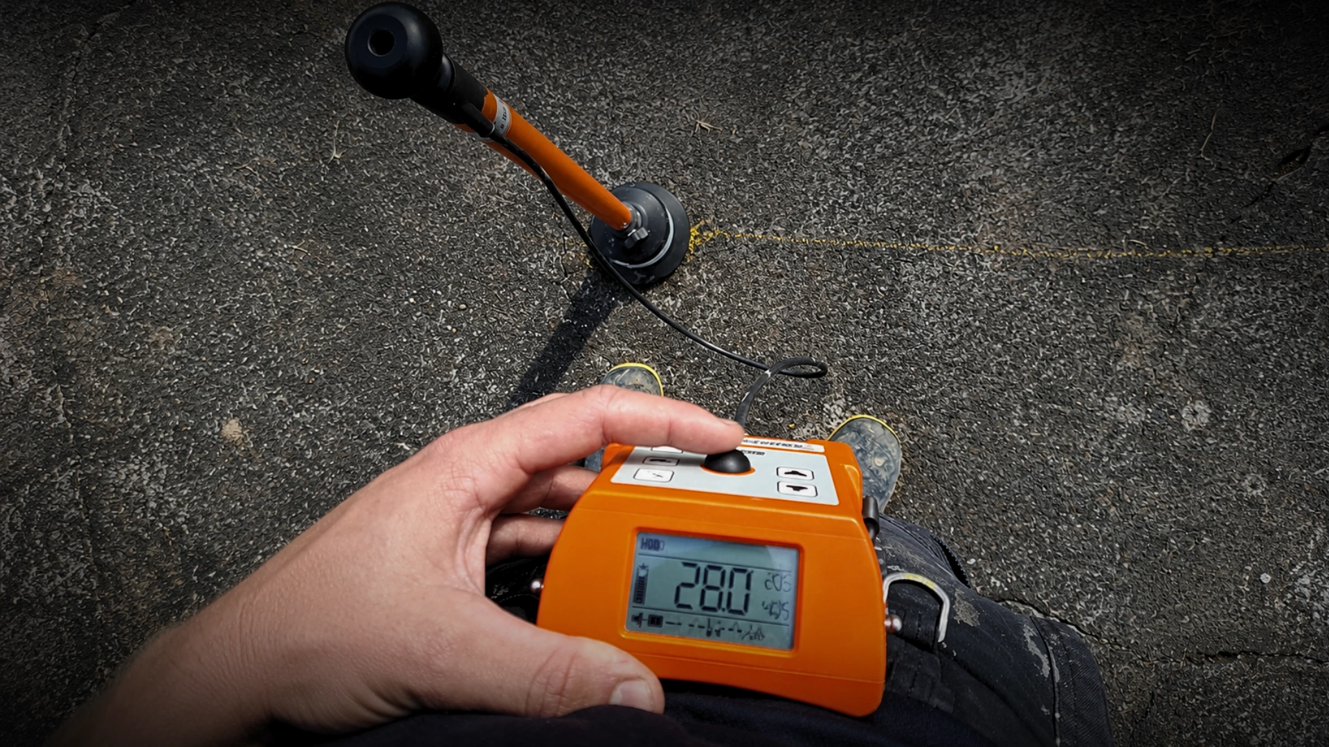 Plumber using acoustic leak detection equipment on a Napier water line