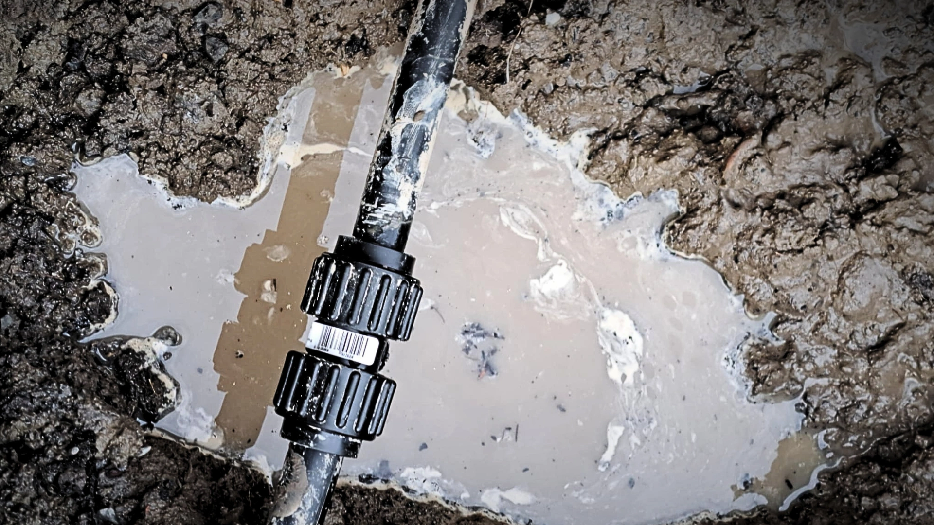 Crew repairing a water main connection in a Napier roadside excavation